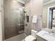 Modern bathroom featuring a glass-enclosed shower, and sleek fixtures at 5305 Brookgrove Dr, Sarasota, FL 34238