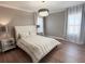 Inviting bedroom with a tufted headboard bed, elegant nightstands, and ambient lighting at 5305 Brookgrove Dr, Sarasota, FL 34238