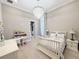 Bright bedroom with a chandelier, and a well-organized closet at 5305 Brookgrove Dr, Sarasota, FL 34238