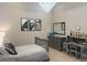 Bedroom with chandelier, neutral tones, work area and built-in bookshelves at 5305 Brookgrove Dr, Sarasota, FL 34238