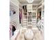 Spacious walk-in closet with custom shelving, drawers, and ample storage at 5305 Brookgrove Dr, Sarasota, FL 34238