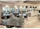 Clubhouse dining area with multiple tables and chairs, plus kitchen access at 5305 Brookgrove Dr, Sarasota, FL 34238