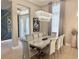 Elegant dining room with a modern chandelier and stylish decor, creating an inviting atmosphere at 5305 Brookgrove Dr, Sarasota, FL 34238