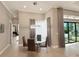Cozy dining area with a glass table and elegant chandelier, perfect for intimate meals at 5305 Brookgrove Dr, Sarasota, FL 34238