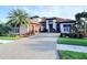 Stunning two-story home with a long driveway and well manicured landscaping at 5305 Brookgrove Dr, Sarasota, FL 34238