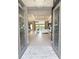 Inviting foyer with chandelier, an open floor plan, and views of the living and dining areas at 5305 Brookgrove Dr, Sarasota, FL 34238