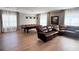 Large game room with pool table, hardwood floors, sofa, and recessed lighting at 5305 Brookgrove Dr, Sarasota, FL 34238