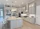 Gourmet kitchen boasts custom cabinets, stainless steel appliances, and marble countertops at 5305 Brookgrove Dr, Sarasota, FL 34238