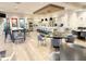 Clubhouse kitchen and gathering space with pendant lighting and modern furniture at 5305 Brookgrove Dr, Sarasota, FL 34238