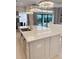 Open-concept kitchen with island seating and seamless flow to the outdoor patio at 5305 Brookgrove Dr, Sarasota, FL 34238