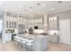Elegant kitchen featuring an island with bar seating and designer lighting at 5305 Brookgrove Dr, Sarasota, FL 34238