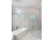 Beautiful main bathroom features a freestanding tub and a glass-enclosed shower at 5305 Brookgrove Dr, Sarasota, FL 34238