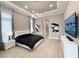 Stylish main bedroom with a modern platform bed, tray ceiling, and contemporary decor at 5305 Brookgrove Dr, Sarasota, FL 34238