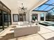 Beautiful outdoor patio featuring comfortable seating, dining area, and a screened-in pool and spa for relaxation at 5305 Brookgrove Dr, Sarasota, FL 34238