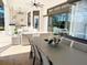 Inviting outdoor patio with dining area, seating area, and fully equipped outdoor kitchen for entertaining guests at 5305 Brookgrove Dr, Sarasota, FL 34238