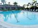 Resort-style pool featuring multiple lanes and lounge chairs for relaxing by the water at 5305 Brookgrove Dr, Sarasota, FL 34238