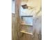 This detailed shower has a rainfall shower head and a custom tiled niche at 5305 Brookgrove Dr, Sarasota, FL 34238