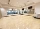 Large dance and exercise studio with hardwood floor and mirrored wall at 5305 Brookgrove Dr, Sarasota, FL 34238