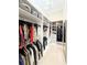 Well-organized walk-in closet with shelving and hanging space for optimal storage at 5305 Brookgrove Dr, Sarasota, FL 34238
