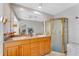 Spacious bathroom with a double sink vanity and a glass-enclosed shower at 5376 Shadow Lawn Dr, Sarasota, FL 34242