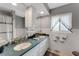 Bathroom featuring double sinks, stylish hardware, and ample counter space at 5376 Shadow Lawn Dr, Sarasota, FL 34242