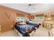 Bedroom featuring two twin beds, basketball themed bedding, and a ceiling fan at 5376 Shadow Lawn Dr, Sarasota, FL 34242