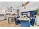 Open concept dining area with views to living room and kitchen, complete with a modern ceiling fan at 5376 Shadow Lawn Dr, Sarasota, FL 34242