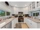 Bright kitchen with granite counters, stainless appliances, and neutral countertops at 5376 Shadow Lawn Dr, Sarasota, FL 34242