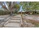 Charming backyard leading to the canal, complete with kayak storage at 5402 Shadow Lawn Dr, Sarasota, FL 34242