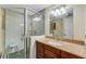 Updated bathroom features granite countertops, a glass shower, and vanity with plenty of storage at 5402 Shadow Lawn Dr, Sarasota, FL 34242
