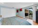 Bright bedroom boasts a double closet and sliding glass doors leading to the patio at 5402 Shadow Lawn Dr, Sarasota, FL 34242