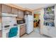 Efficient kitchen with ample storage, adjacent to a separate room, and essential appliances at 5402 Shadow Lawn Dr, Sarasota, FL 34242