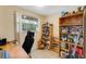 Functional office space with natural light, shelving, and a comfortable workspace at 5402 Shadow Lawn Dr, Sarasota, FL 34242
