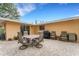 Outdoor patio seating area with furniture and black grill at 5402 Shadow Lawn Dr, Sarasota, FL 34242