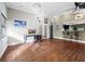 Bright and airy living area featuring hardwood floors, modern lighting, and an open floor plan at 5645 Churchill Downs Rd, Sarasota, FL 34241