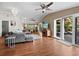 Bright living room features hardwood floors, decorative lighting, and comfortable gray sectional at 5645 Churchill Downs Rd, Sarasota, FL 34241