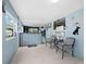 Inviting reception area with blue walls, tiled floors, and a modern reception desk, creating a welcoming atmosphere at 5645 Churchill Downs Rd, Sarasota, FL 34241