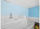 Practical utility area with a large white sink, offering a functional space for various cleaning tasks at 5645 Churchill Downs Rd, Sarasota, FL 34241