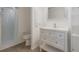 Bathroom featuring vanity with sink, shower with glass doors, and tile flooring at 625 Ennis Nw Ter, Port Charlotte, FL 33952