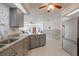 Open kitchen features granite countertops and stainless steel appliances at 625 Ennis Nw Ter, Port Charlotte, FL 33952