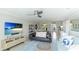 Bright and inviting living room featuring stylish furnishings and beach-themed decor at 7155 Gulf Of Mexico Dr # 22, Longboat Key, FL 34228