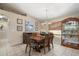 Charming dining room featuring a decorative hutch, stylish table, and elegant chandelier lighting at 1577 Taggard Rd, North Port, FL 34288