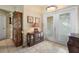 Elegant foyer showcasing decorative glass doors, tile flooring, and a classic display cabinet at 1577 Taggard Rd, North Port, FL 34288