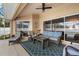 Relaxing screened lanai with comfortable seating overlooking the pool and lush backyard at 1577 Taggard Rd, North Port, FL 34288