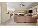 Open living space with tile flooring, comfortable seating, and access to the dining area and outdoor lanai at 1577 Taggard Rd, North Port, FL 34288
