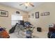 Comfortable home office featuring natural light, tile flooring, and ample desk space at 1577 Taggard Rd, North Port, FL 34288