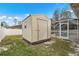Outdoor shed providing extra storage space, located next to the screened pool area at 1577 Taggard Rd, North Port, FL 34288