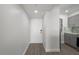 An entryway leading to the kitchen area with updated luxury vinyl plank flooring at 1751 Beach Rd # 404, Englewood, FL 34223