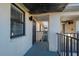 The exterior of a condo building featuring a walkway and stucco walls at 1751 Beach Rd # 404, Englewood, FL 34223