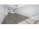 A large living room area with luxury vinyl plank flooring and an open kitchen at 1751 Beach Rd # 404, Englewood, FL 34223